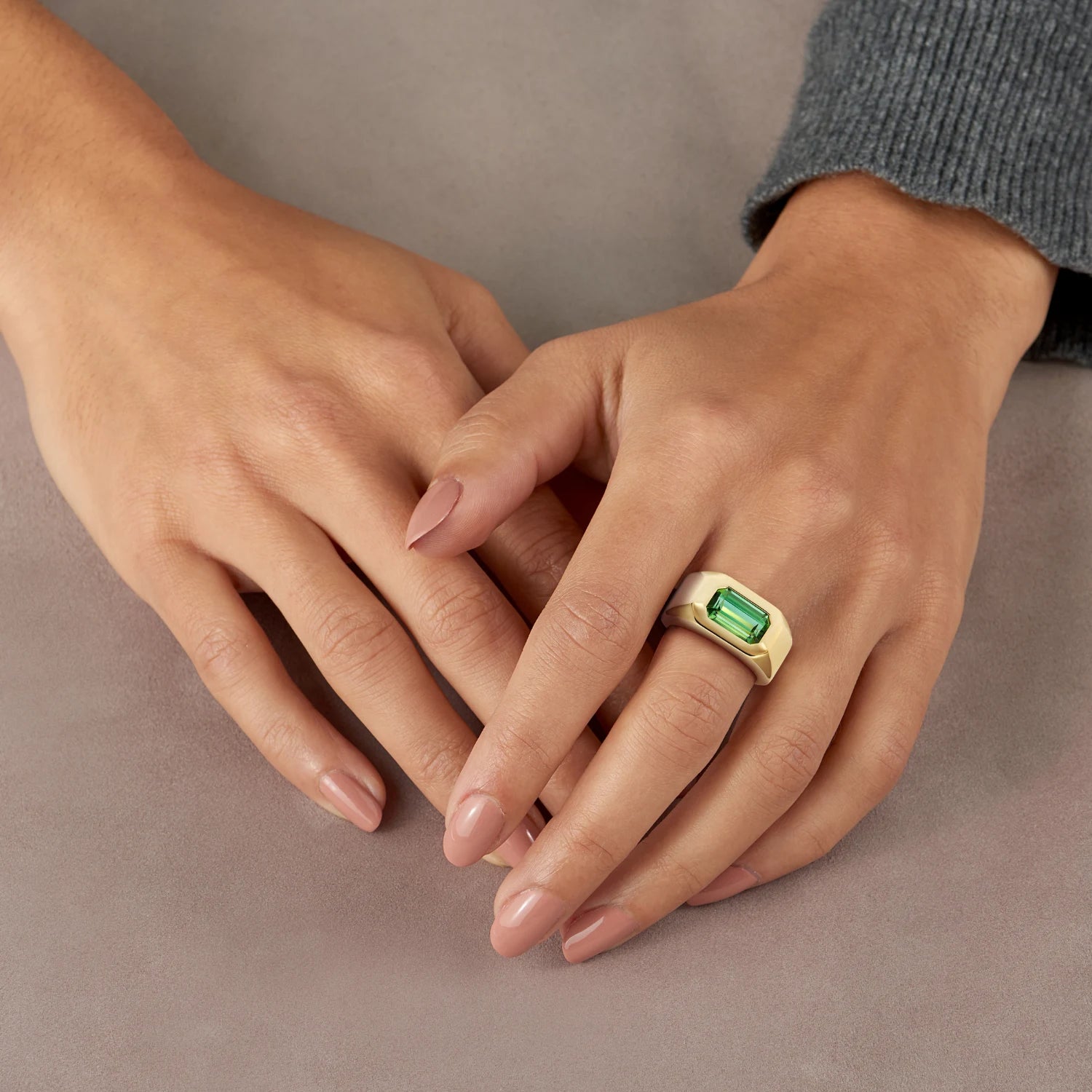 Hand model wearing Berlin Cocktail Ring, 18k gold with 3ct octagonal-cut blue/green tourmaline, bold Bauhaus-inspired unisex design.