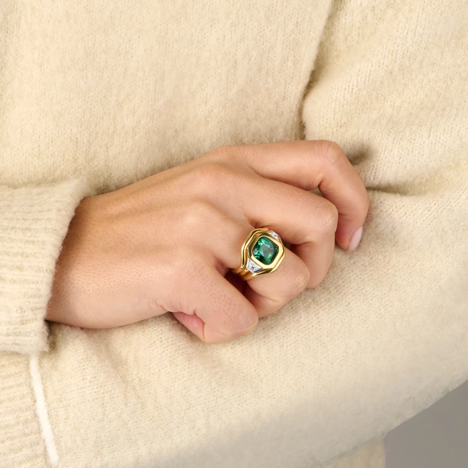 Hand model wearing Berlin Nights 5.96ct green tourmaline ring in 18k yellow gold and platinum with geometric-cut gemstone and diamonds