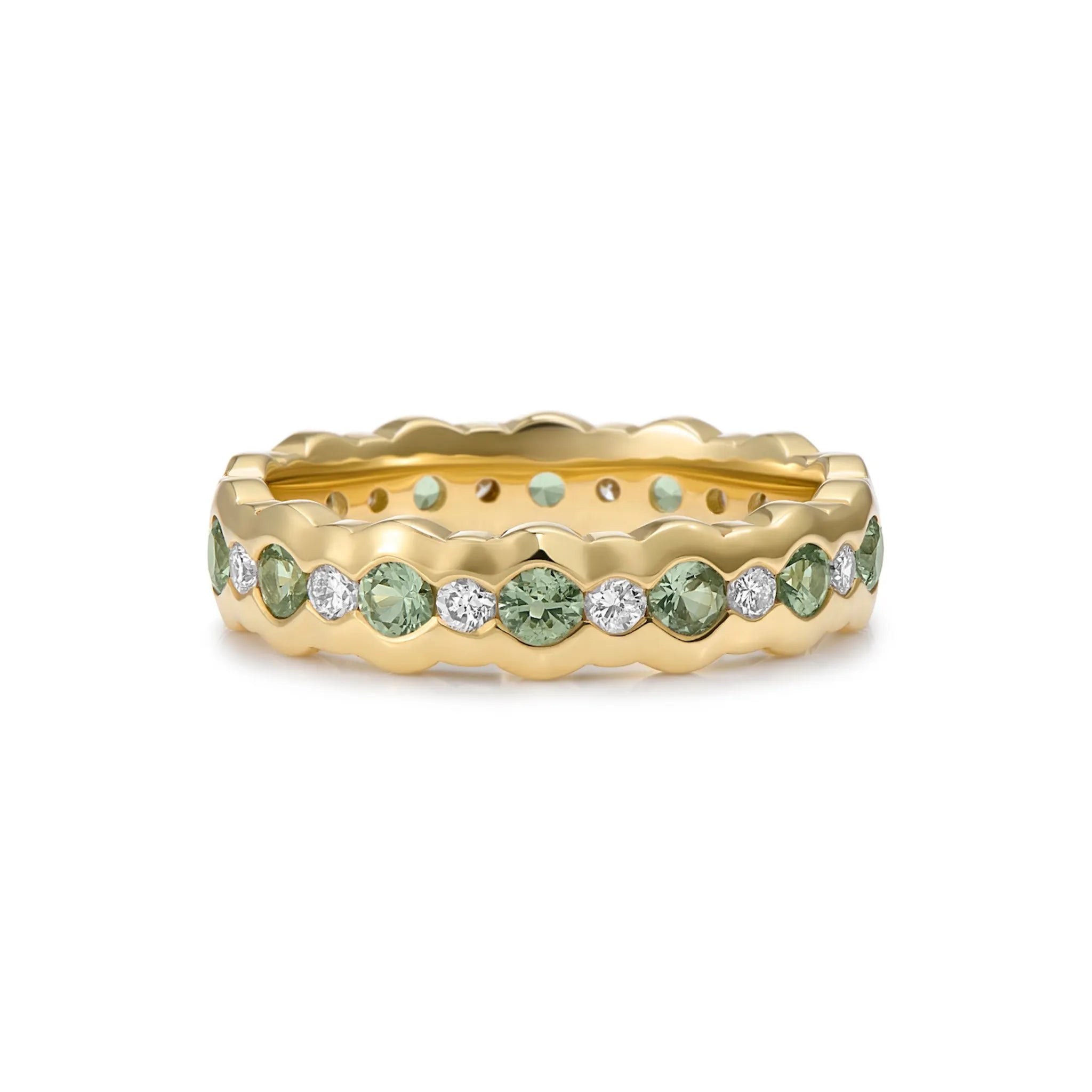 Front view of green sapphire and diamond eternity ring in solid 18k yellow gold with wavy band, vivid green sapphires and round-cut white diamonds