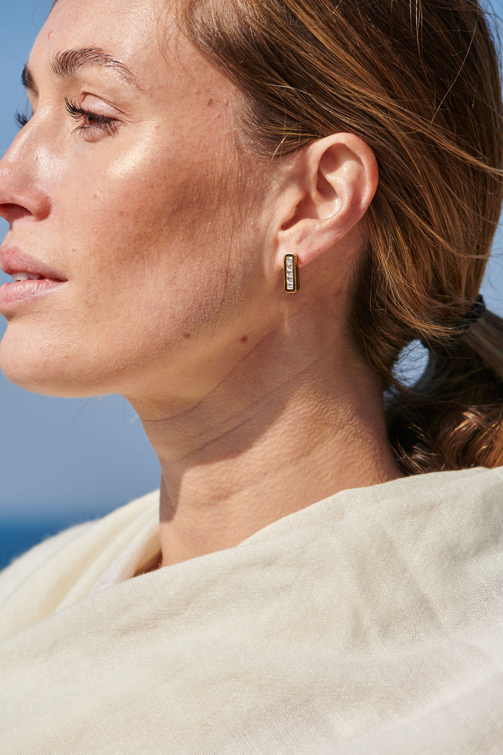 Model wearing Minka Jewels Ley Line Glastonbury Set Diamond Earrings with brushed gold finish