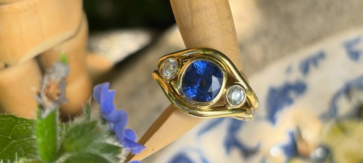 Cleaning a sapphire engagement ring with warm water and a soft toothbrush