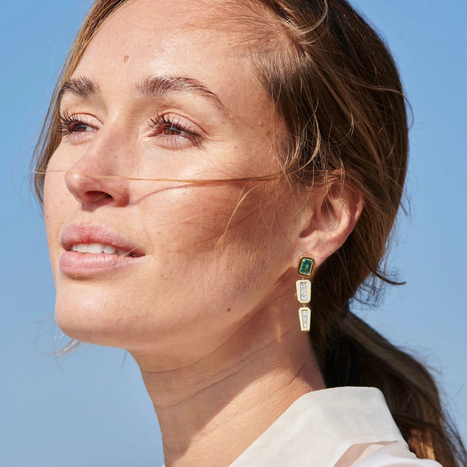 Model wearing Ley Lines Standing Stone Earrings, 18k gold with tourmalines and carré-cut diamonds, elegant drop style