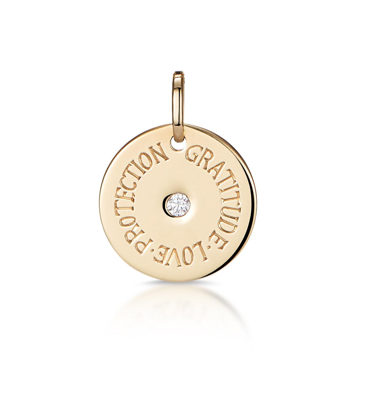 Front view of 15mm engraved mantra disc pendant with central diamond and three-word Gratitude, Love, Protection, oval jump ring for easy chain attachment
